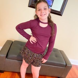Girls cut out top long sleeves in purple.